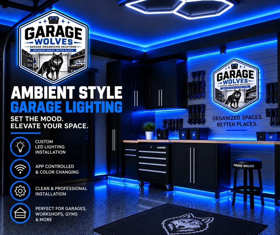 Garage lit in blue accent LED along the ceiling and cabinet lines, with a workbench and tool drawers below