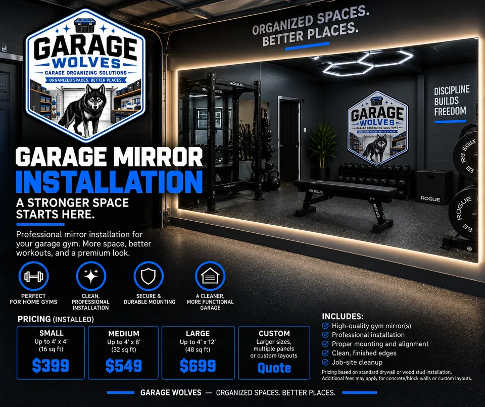 Wall mirror mounted along a garage gym wall beside a rack and bench, lit by warm perimeter lighting